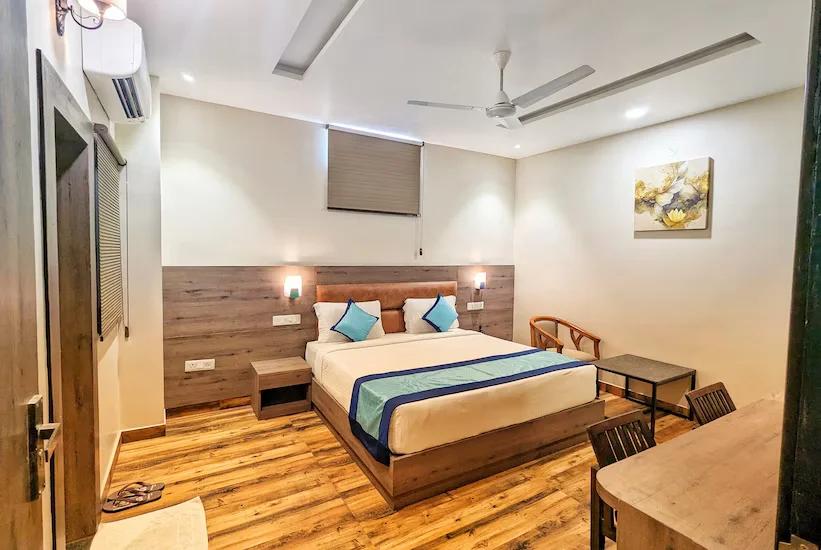 a bedroom with a tv at Elegance Suites in Lucknow hotel_Image