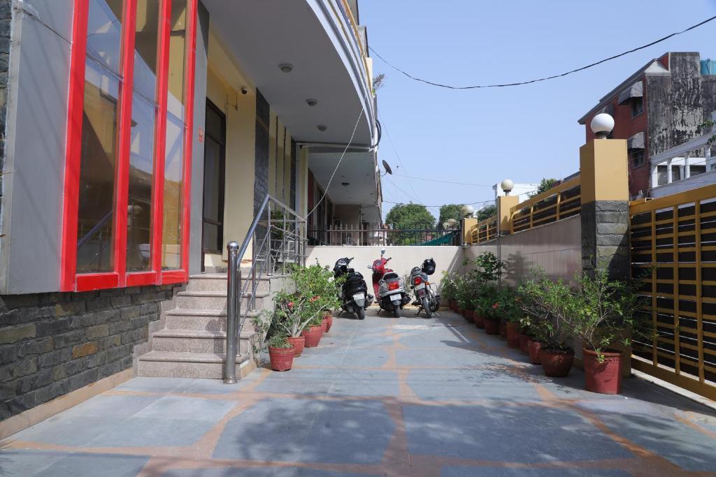 three bike parked in front of it at hotel sunshine residency castle in Noida hotel_Image