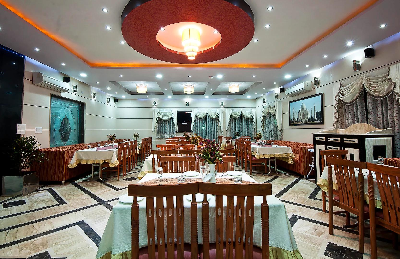 gallery image with sofa and chairs at sun hotel in agra hotel_Image