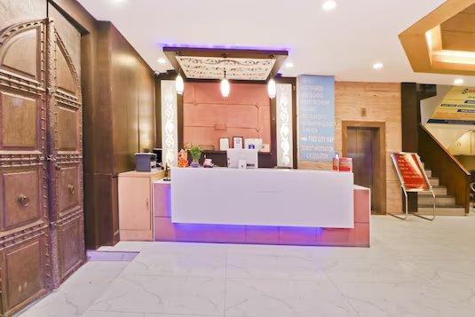 a reception area with sofa and stairs at travok resort and spa in mussoorie hotel_Image