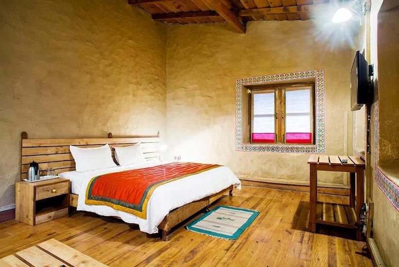 a bedroom at chevron eco lodge in kasauni hotel_Image