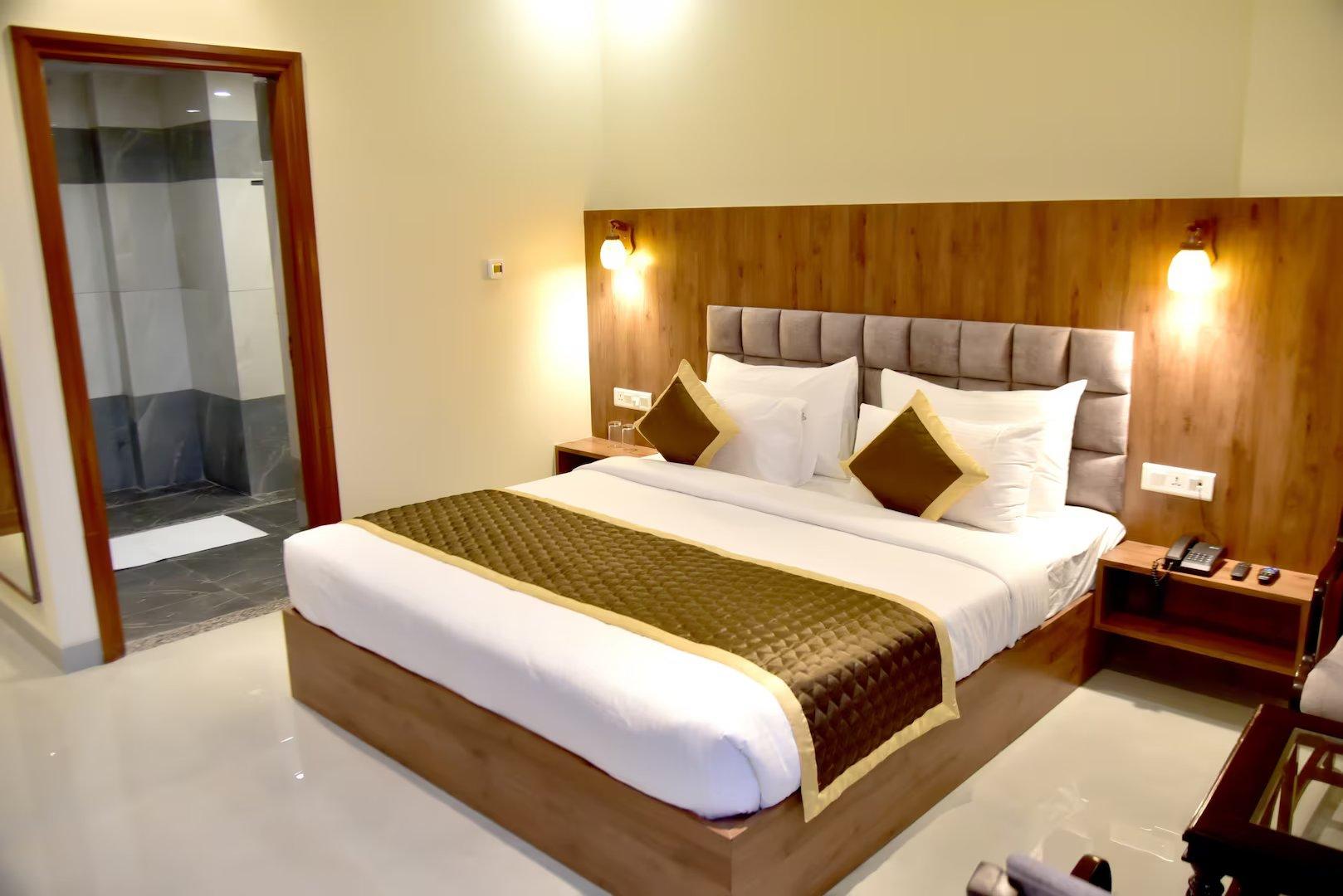 a bed room with t.v at hotel aarna in jaipur hotel_Image