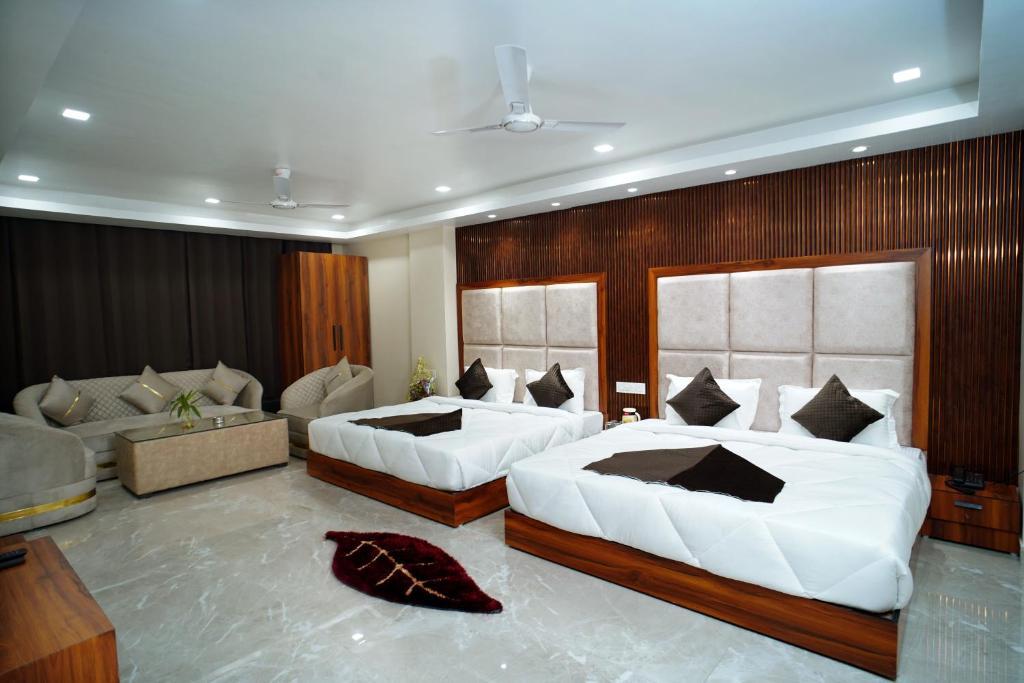 a bed room with t.v at at hotel arsh residency haridwar in haridwar hotel_Image
