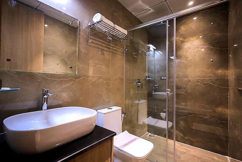 a bathroom with commode at hotel Aryavilas in Mathura hotel_Image