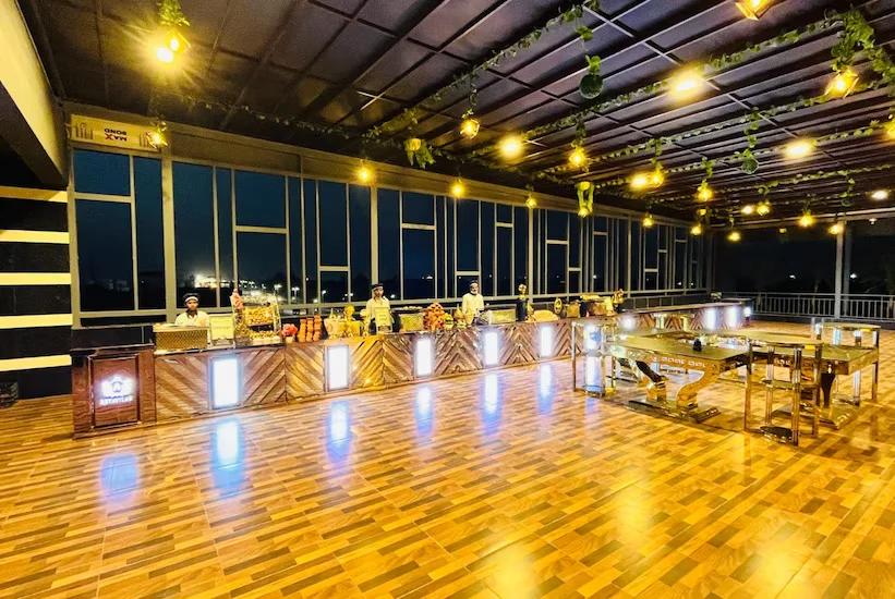 dinner area with table and chair at hotel Aryavilas in Mathura hotel_Image