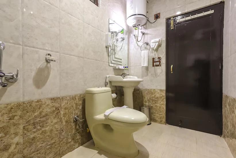 a bathroom with a commode at Hotel holiday hill in Dharamshala hotel_Image
