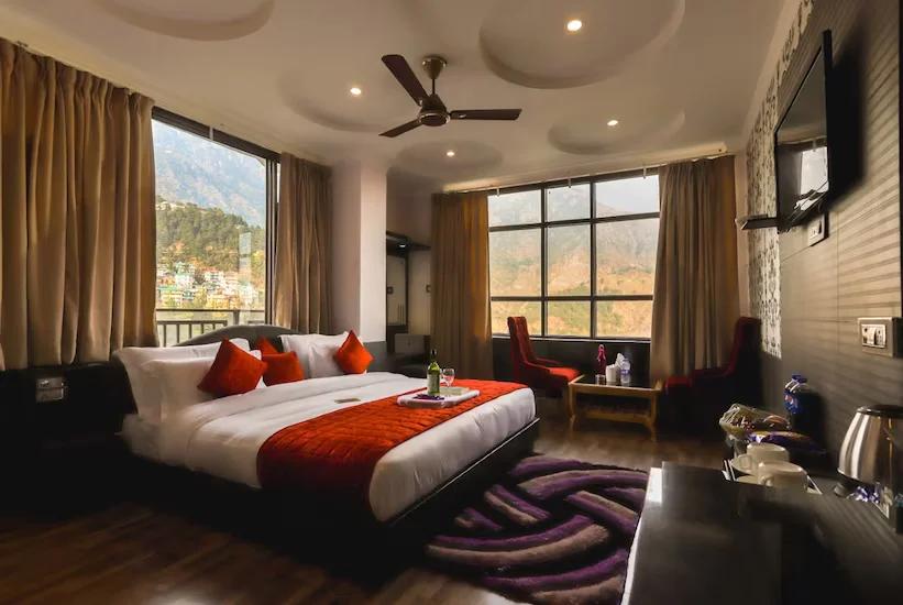 a bedroom with a large bed at Hotel holiday hill in Dharamshala hotel_Image