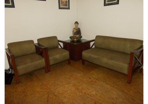 a hotel with meeting area and sofa at the imperial square in mussoorie hotel_Image