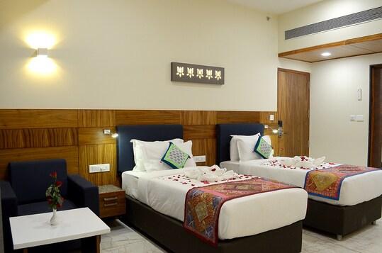 a bed room with t.v at hotel mandovin in udaipur hotel_Image