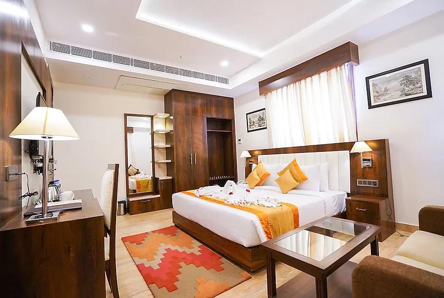 a double bed room with t.v at hotel millenia regency in lucknow hotel_Image