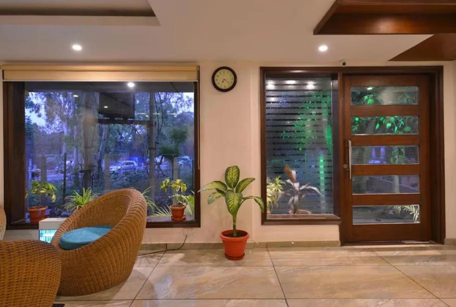 a reception area with garden view at hotel pride in chandigarh hotel_Image