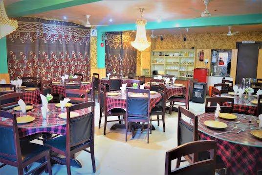 dinner area with chairs and table at hotel star of Kashmir in Srinagar hotel_Image