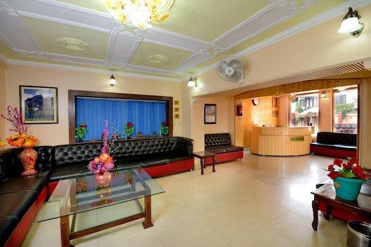 a reception area with sofa and table at hotel star of Kashmir in Srinagar hotel_Image