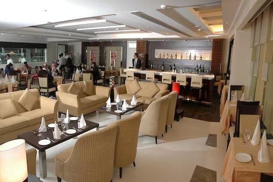 sofas and table at staybook hotel western court in Chandigarh hotel_Image