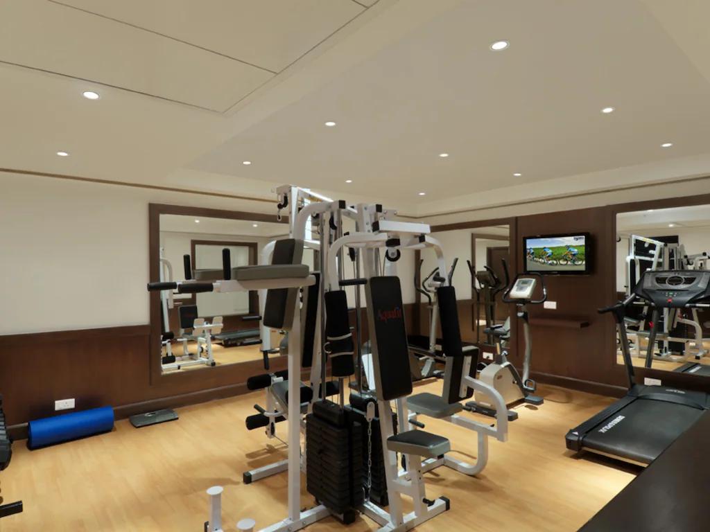 gym at staybook Inde hotel vista woods in Gurugram hotel_Image
