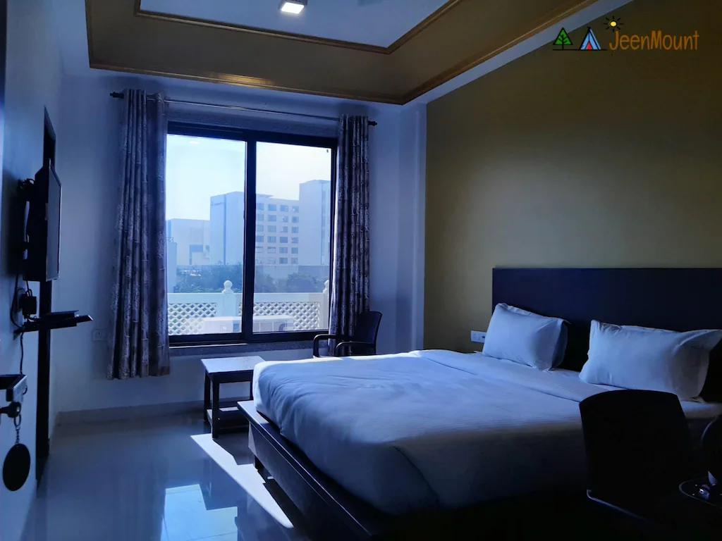 a bedroom with a large bed and a tv at jeenmount heritage boutique hotel in jaipur hotel_Image