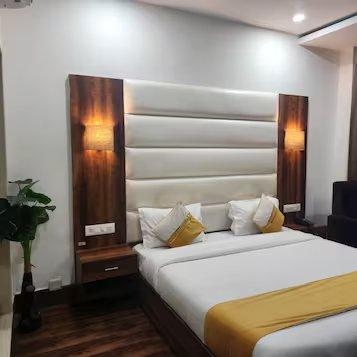 a bedroom with a pant at mm hotel in dharmshala hotel_Image