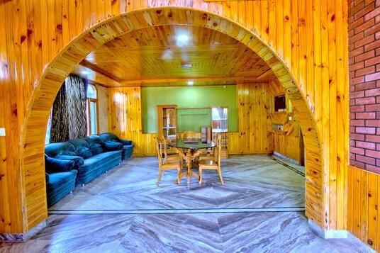 a meeting area with sofa and table at mm hotel in manali hotel_Image