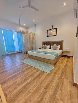 a bedroom with a table at mm resort and spa jim corbett in Uttarakhand hotel_Image