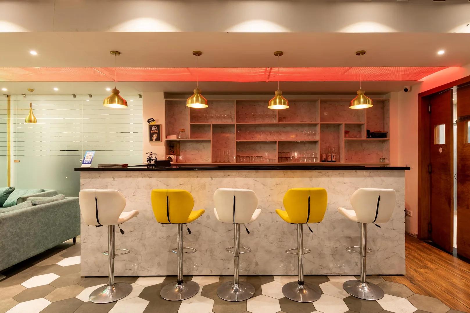 a reception desk with chairs at mv acosta by lawrence hotel in mussoorie hotel_Image