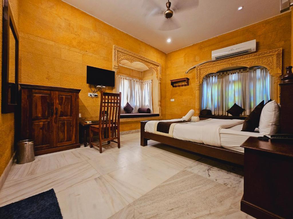 a bedroom with a large bed at royal villa in Jaisalmer hotel_Image