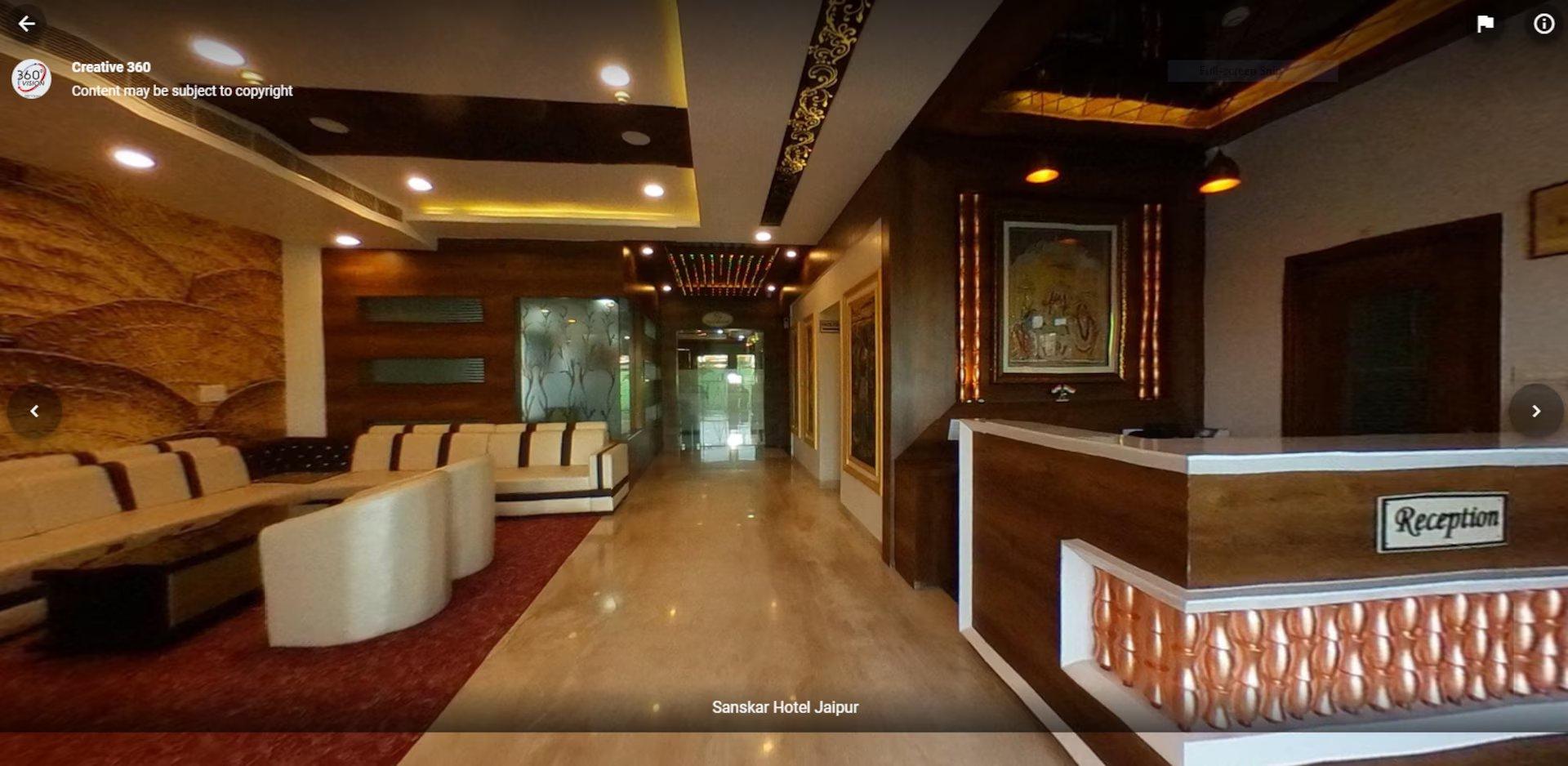 a reception desk with sofa and table at sanskar hotel in jaipur hotel_Image
