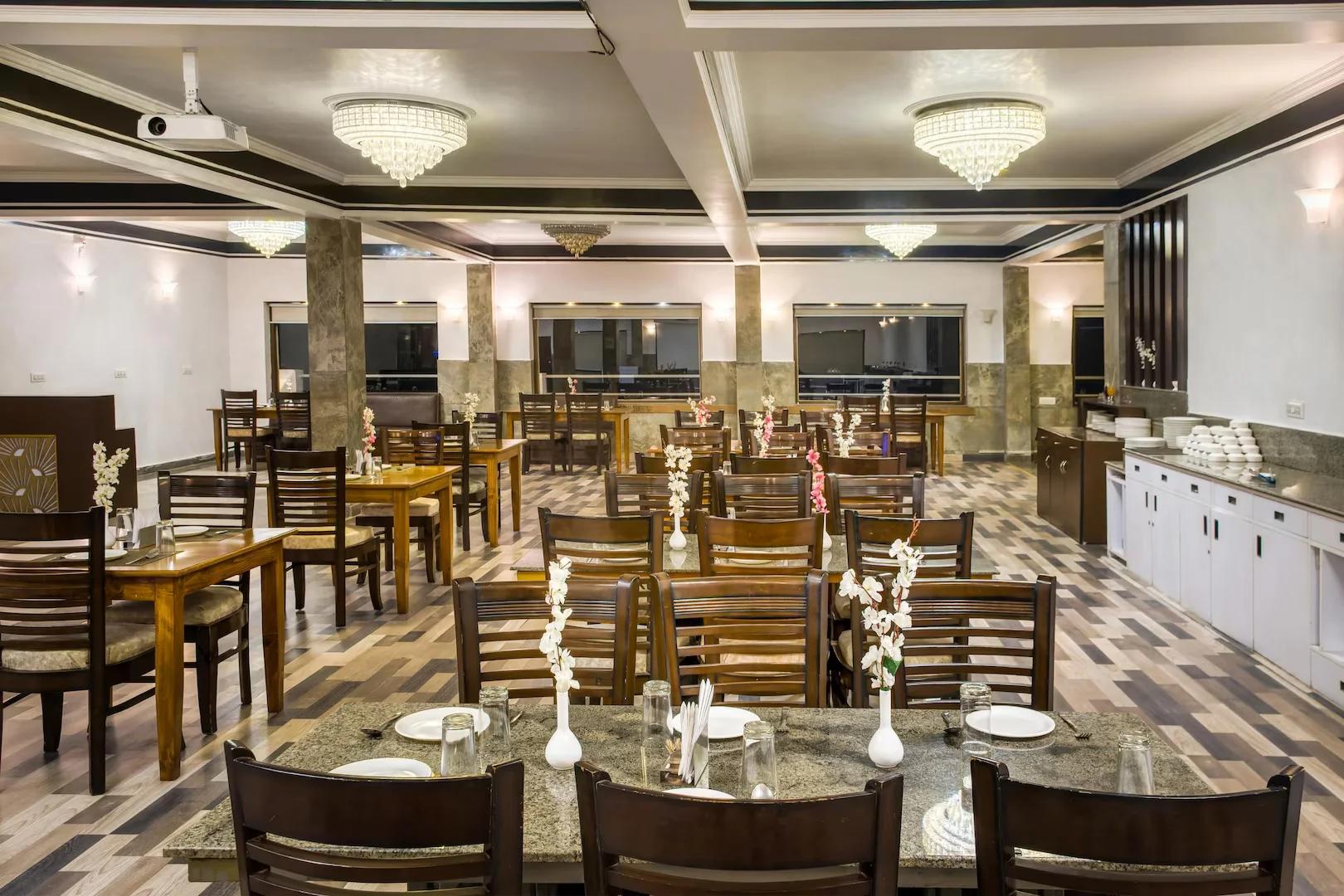 a dining area with chairs and table at hotel shivalik hills in Mussoorie hotel_Image