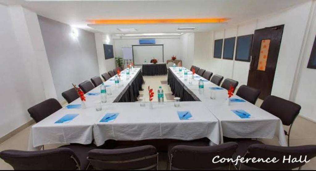a meeting area with chairs and table at skylark hotel by gabrian hotel in gurugram hotel_Image