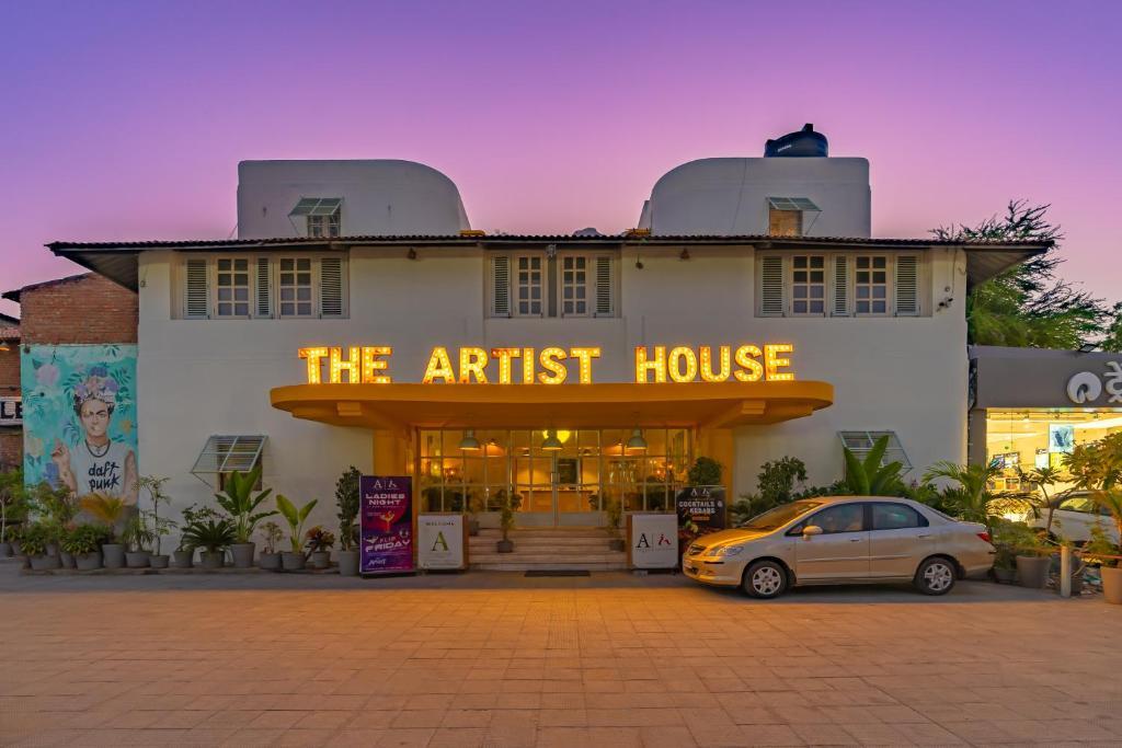 a building with a car parked in front of it at the artist house in udaipur hotel_Image