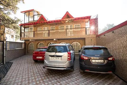 a car parked in front of a hotel with building view at Vamoose Relax Inn in Jodhpur hotel_Image
