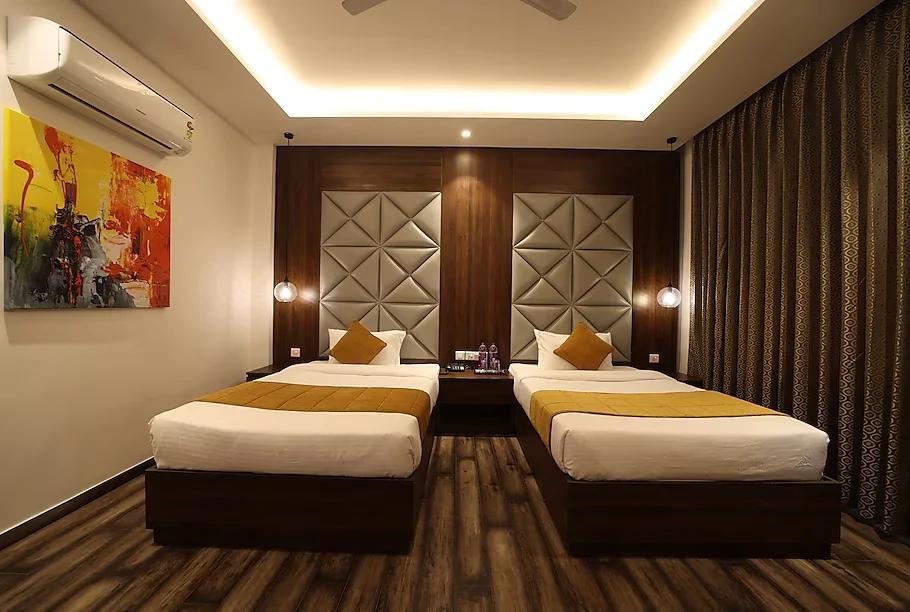 a hotel two single bed one room with pillow at The Vilana Luxurious Hotel in Rishikesh hotel_Image