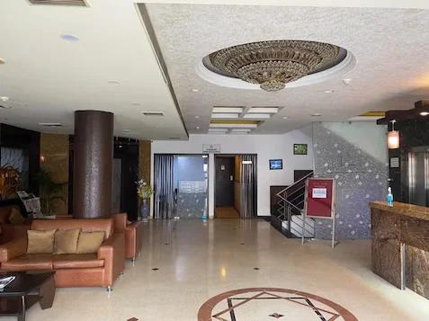 a reception area with sofa and stairs at the raas mahal hotel in jaipur hotel_Image
